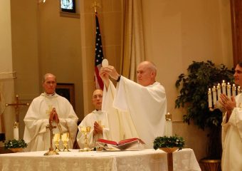 Ken Grooms offering up the eucharist