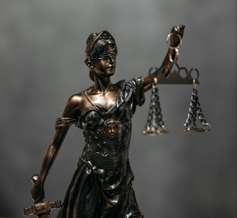 Close-Up Shot of a Statuette of Lady Justice